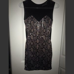 A black snake skin sequin dress